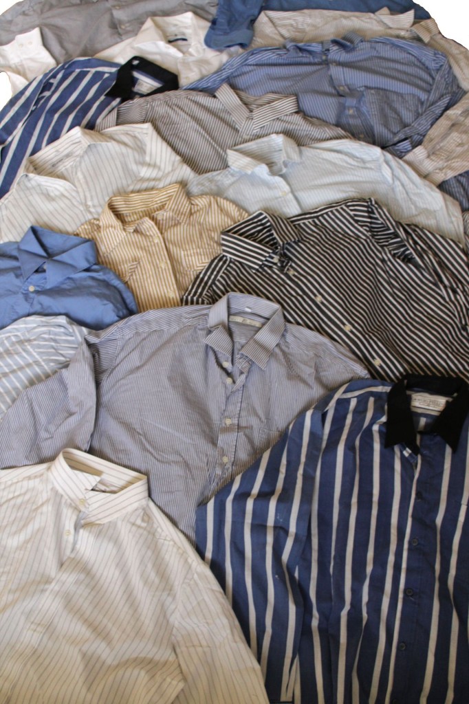 Pile of nearly identical striped button-down shirts